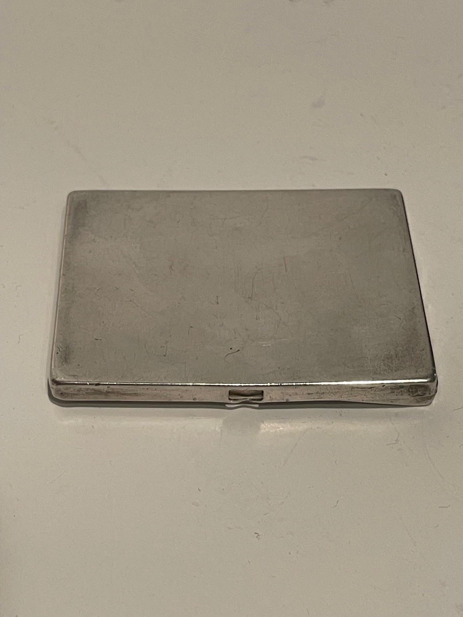 Silver Business Card Holder.  More of a decorative piece now as it is smaller than a regular business card