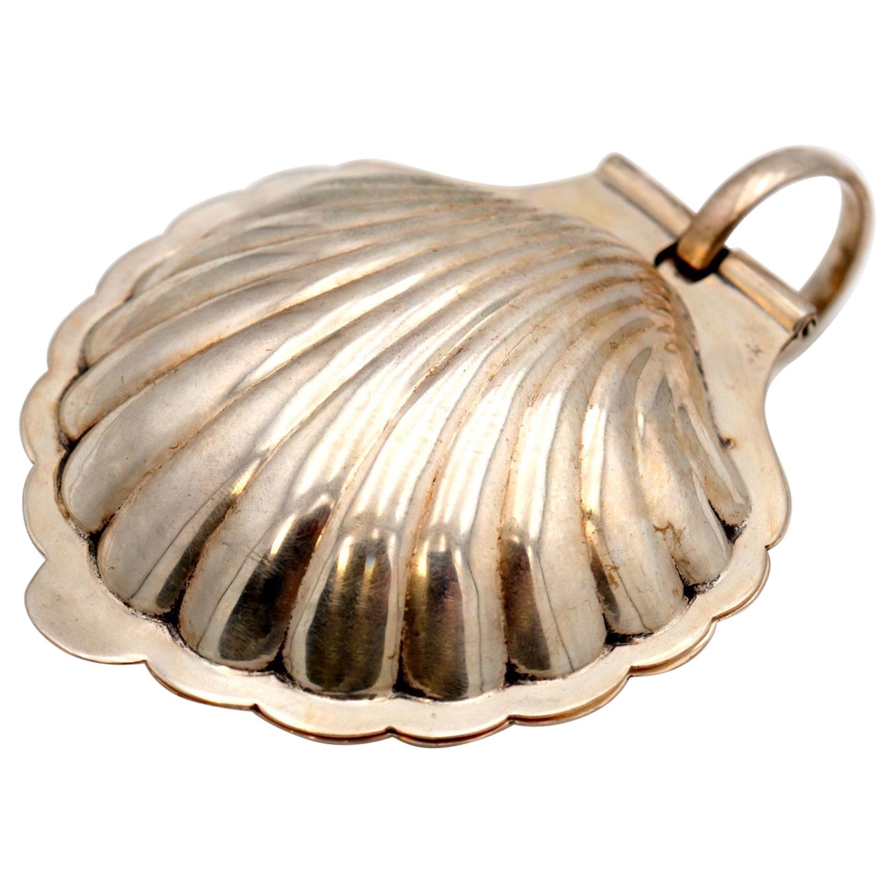 Silver butter dish in the shape of a hinged shell