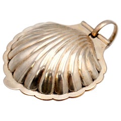 Silver butter dish in the shape of a hinged shell