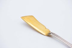 Silver butter knife with gold blade