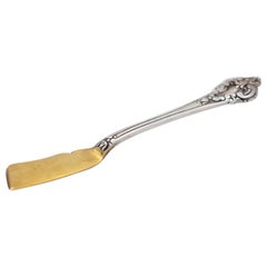 Silver butter knife with gold blade