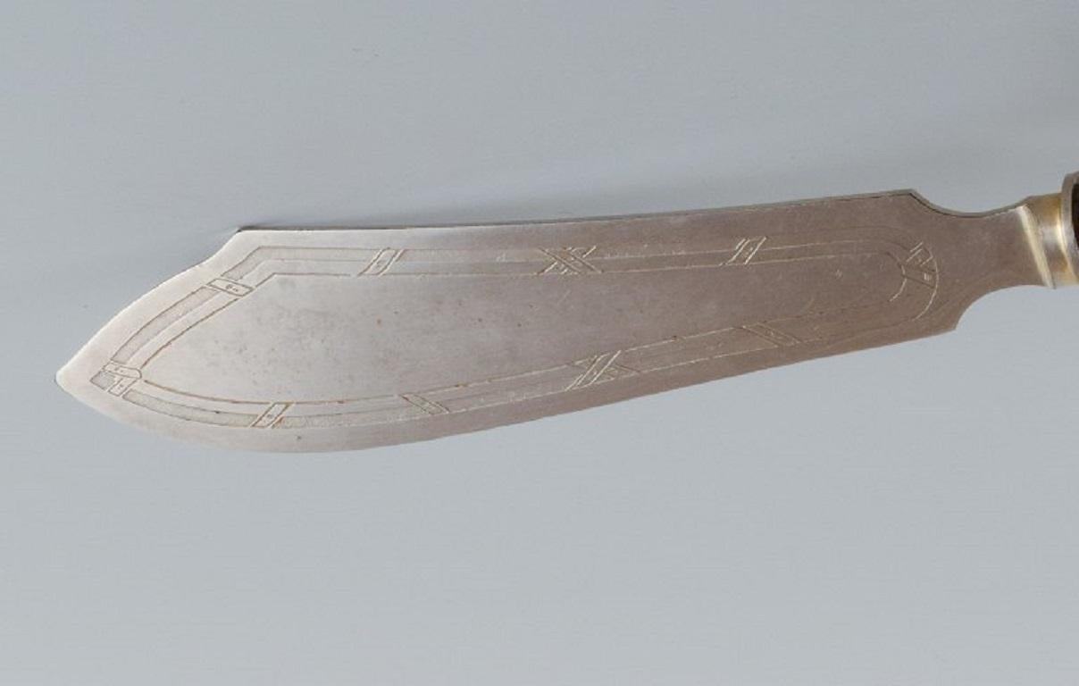 Silver cake knife.
Approx. 1900.
Presumably German, Art Nouveau style.
Marked  800.
In good condition with minor signs of use.
L 27.5 cm.