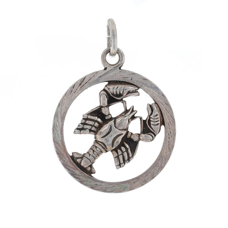 Metal Content: 835 Silver

Theme: Cancer Zodiac Sign, Astrology Lobster
Features: Open Cut Design with Etched Detailing

Measurements

Tall (from stationary bail): 27/32