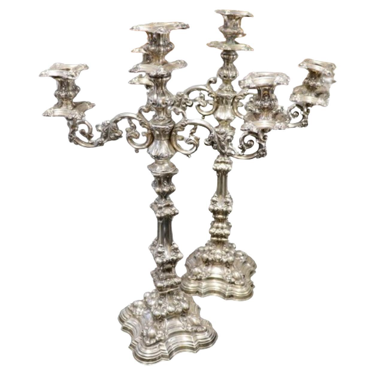 Silver candelabras with reliefs and applications set on gradient beaded bases