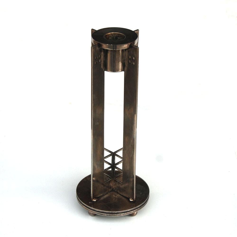 Candleholder by Richard Meier for Swid Powell

Silver plated with a nice patina. Stamped Made in Italy.