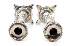 Silver candlestick set with engraved shafts & acanthus-footed base