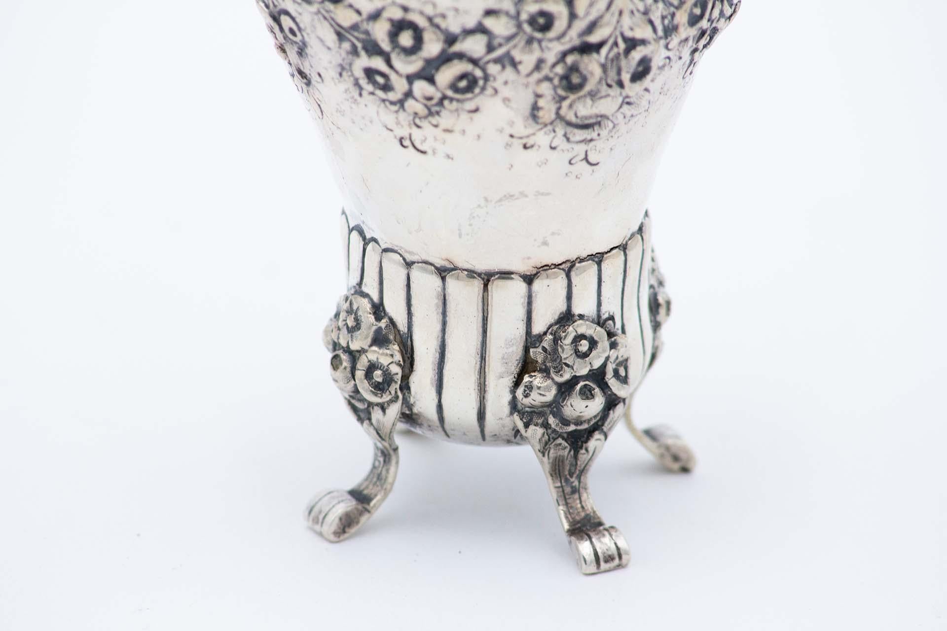 European Silver candlestick with floral motifs, bows and four raised engraved feet For Sale