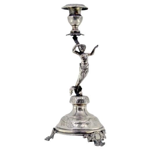 Silver candlestick with flower held by female figure on cut-out base For Sale
