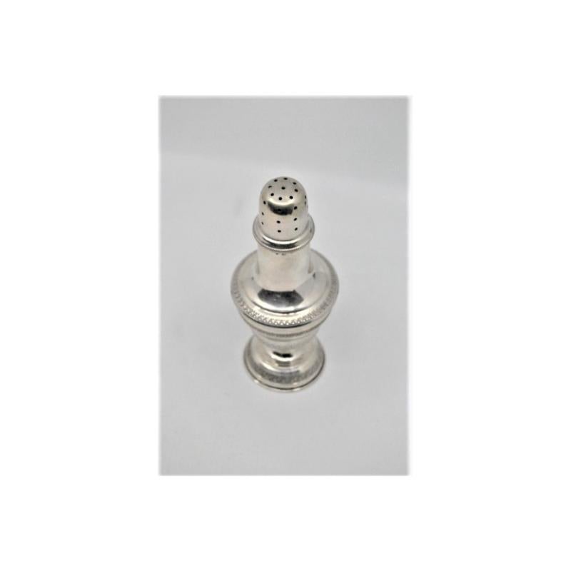 European Silver candlestick with friezes around the edges and set on a circular base For Sale