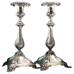 Silver candlesticks with acanthus-embossed shafts on square bases
