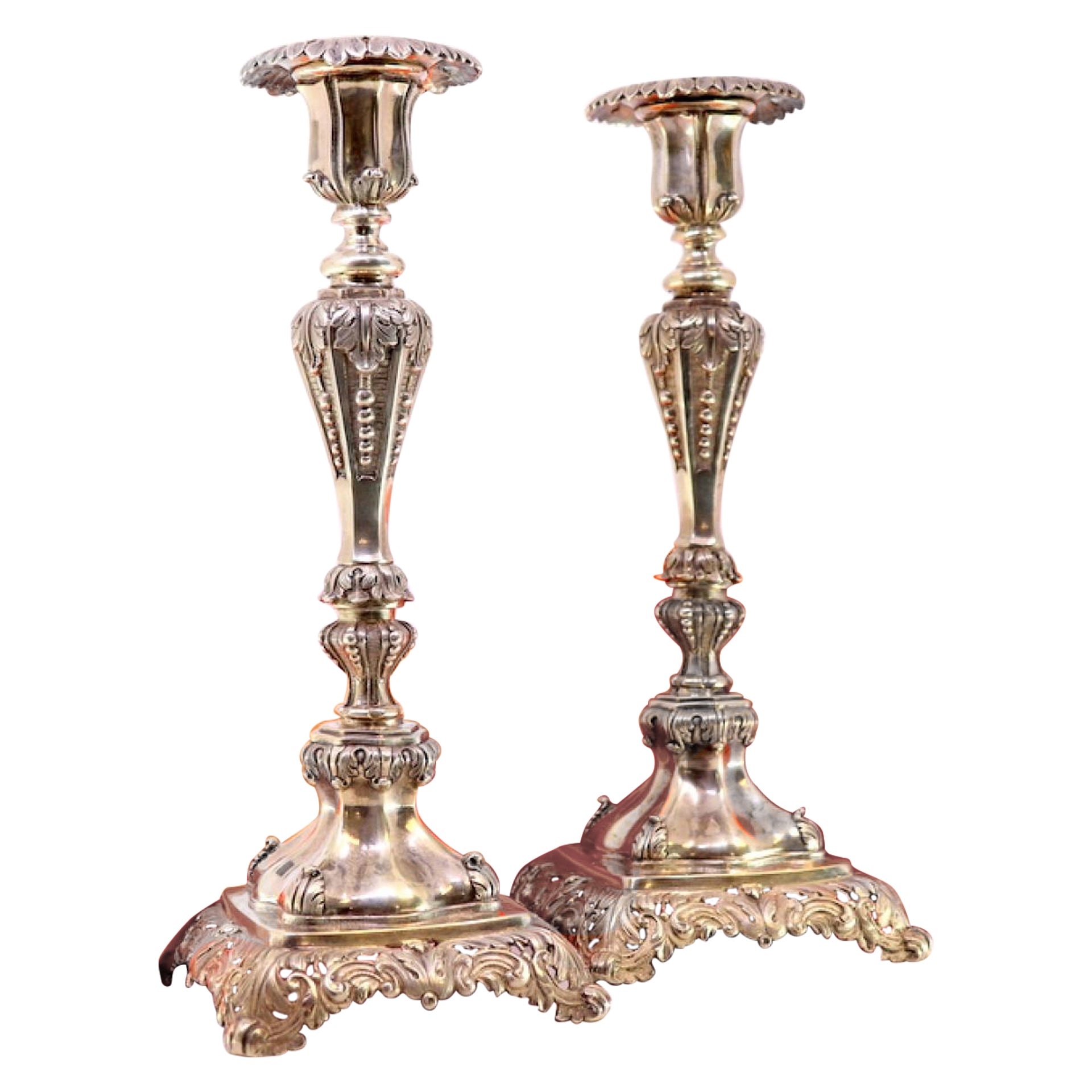Silver candlesticks with acanthus-relief stems on hollow square bases