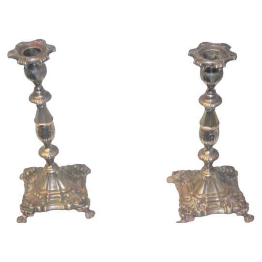 Silver candlesticks with floral embossing, square bases 
claw feet For Sale