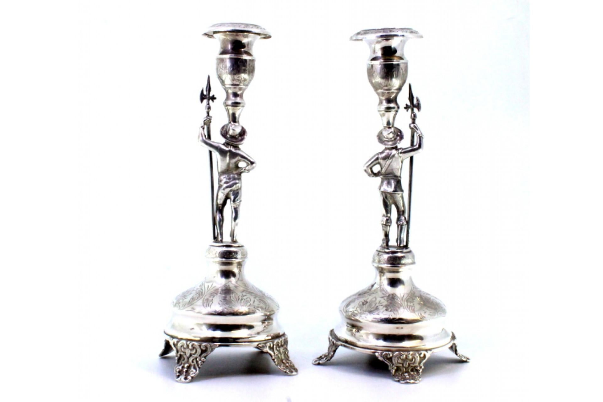 European Silver candlesticks with halberdiers, plant engravings and embossed feet For Sale