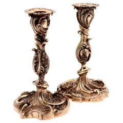 Silver candlesticks with revealed reliefs and applications