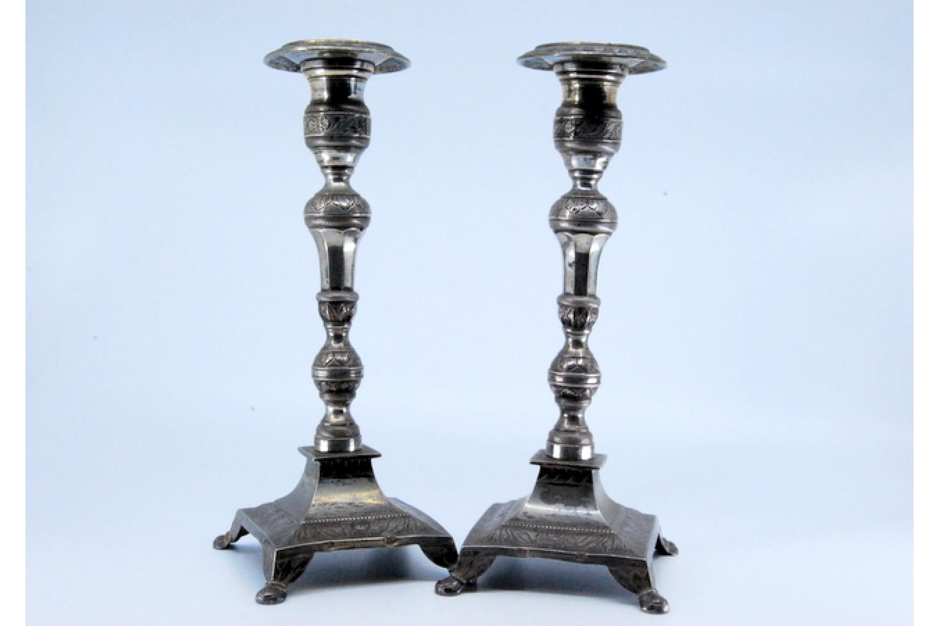 European Silver candlesticks with turned embossed shafts on square bases with four legs For Sale