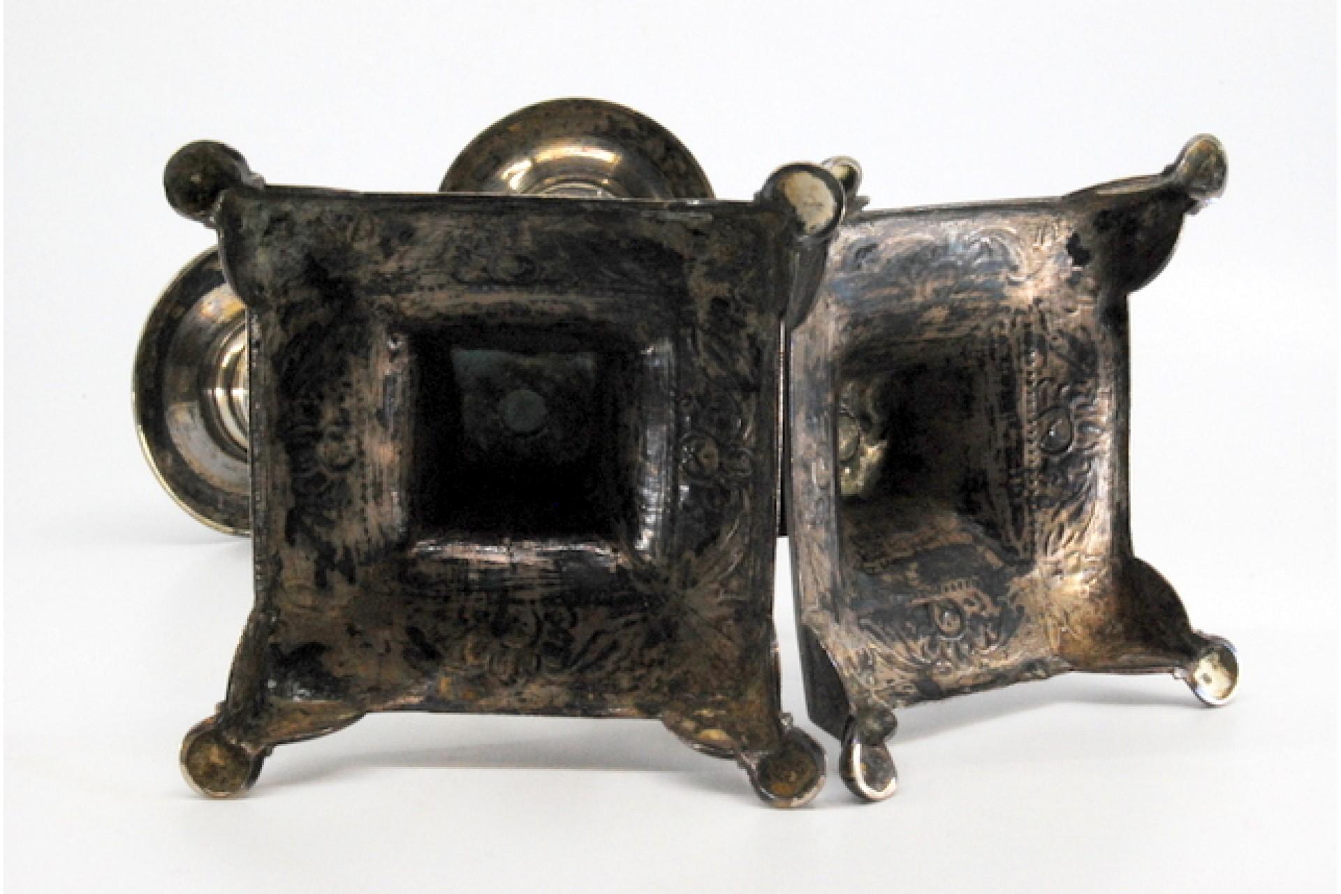 18th Century Silver candlesticks with turned embossed shafts on square bases with four legs For Sale