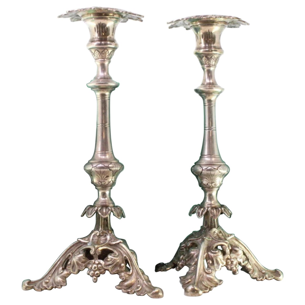 Silver candlesticks with turned stems and acanthus-cut bases