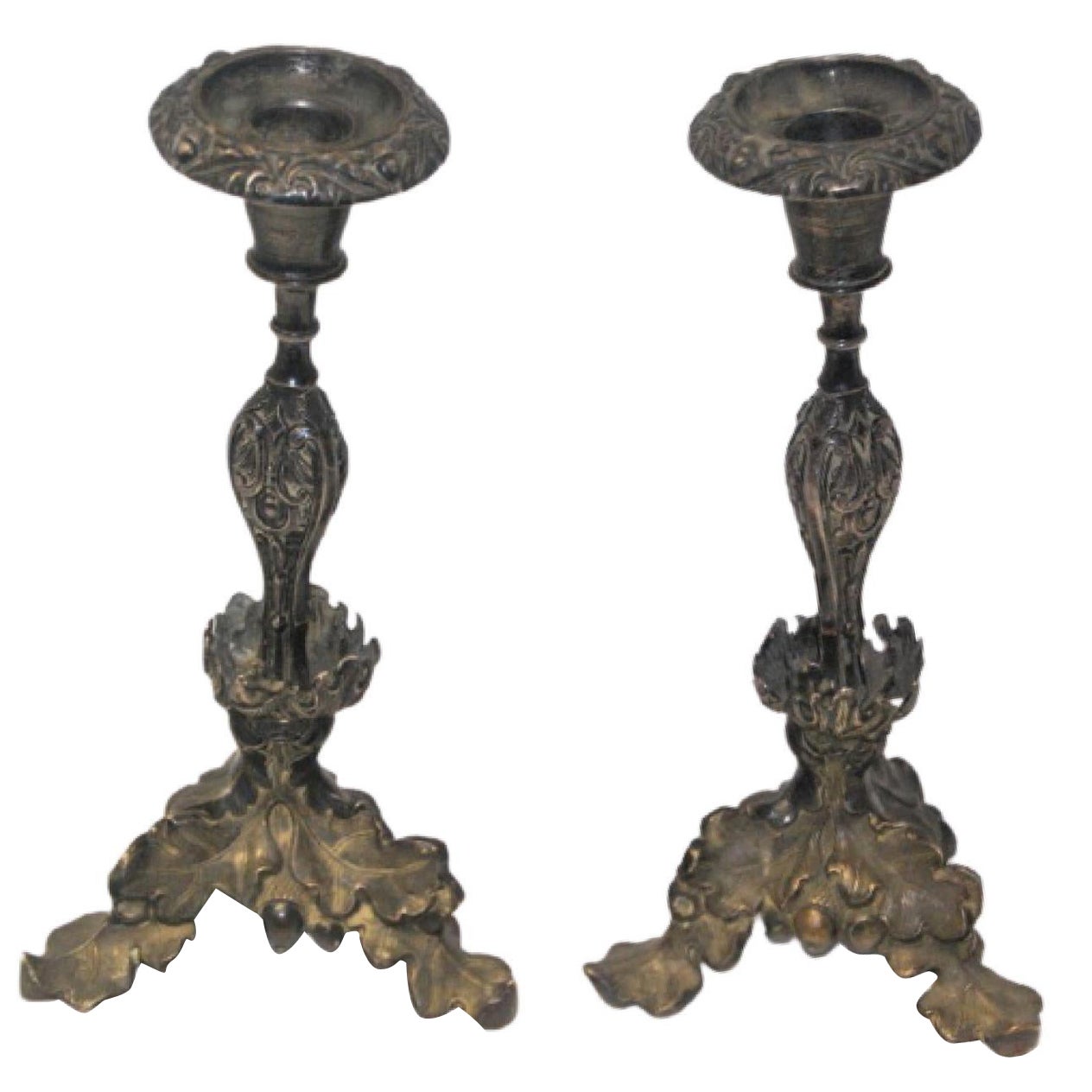 Silver candlesticks with turned stems and acanthus leaves on tripod bases