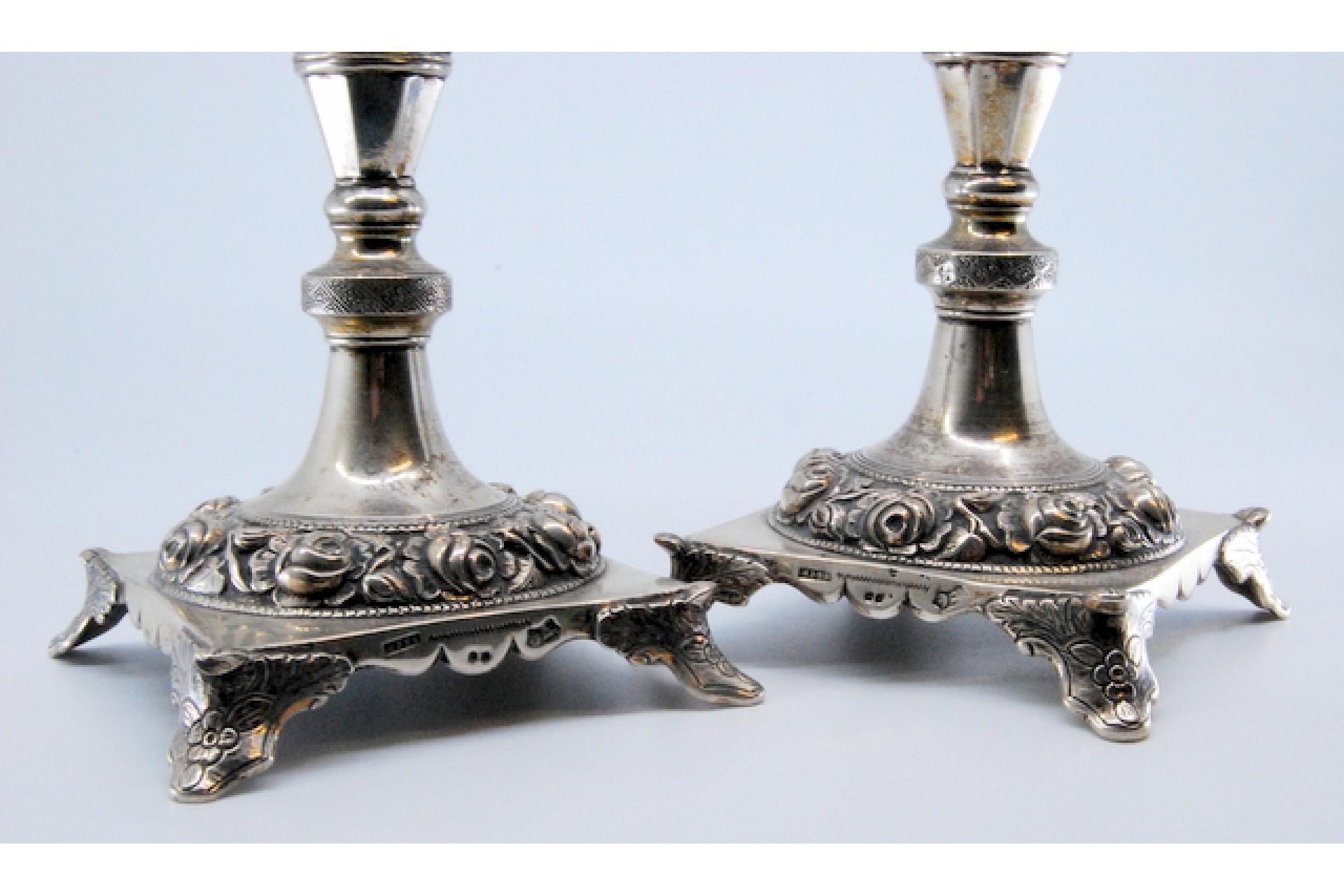 Silver candlesticks with turned stems and floral reliefs on four-foot bases For Sale 4