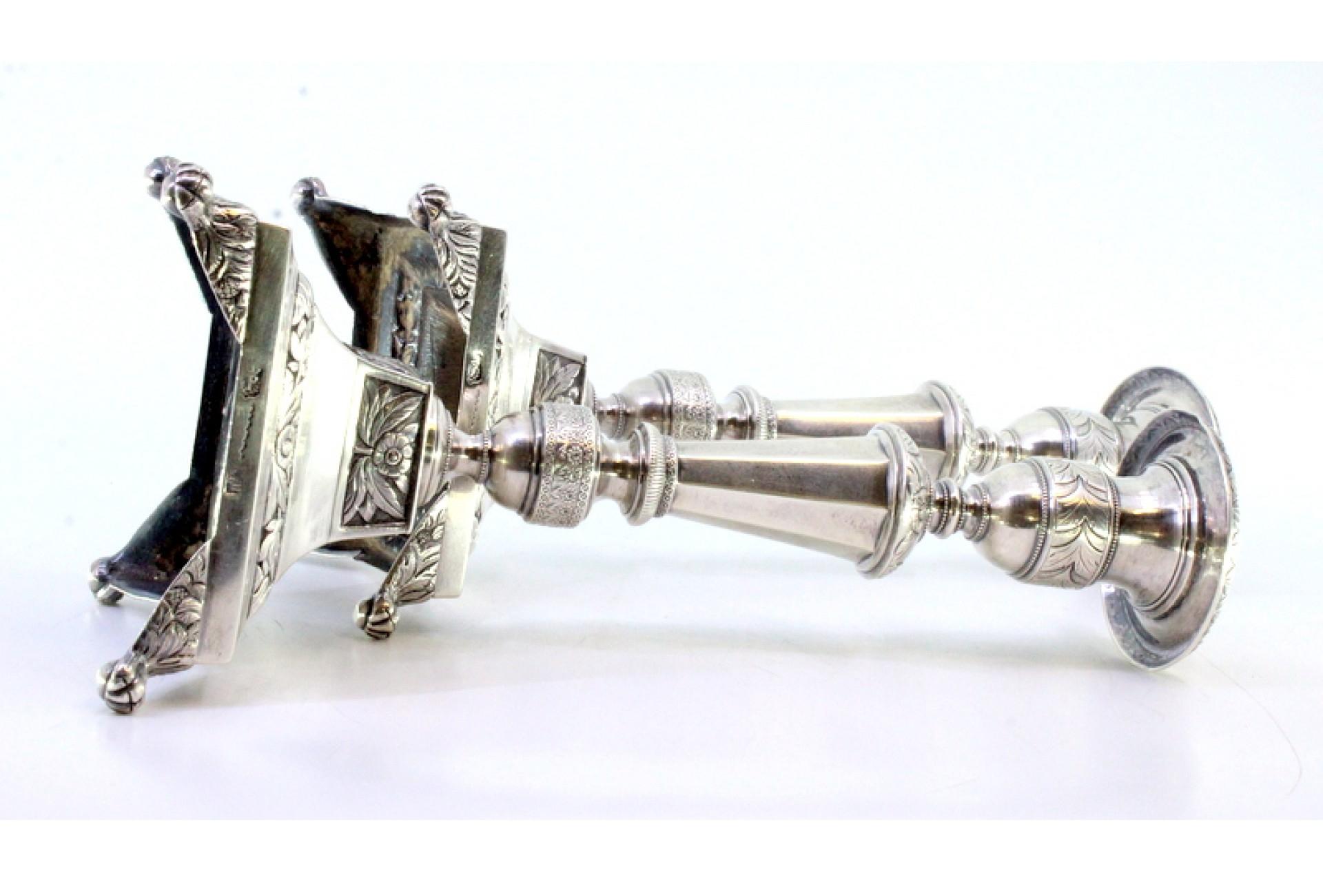 European Silver candlesticks with turned stems, sconces and chiseled bases with claw feet For Sale
