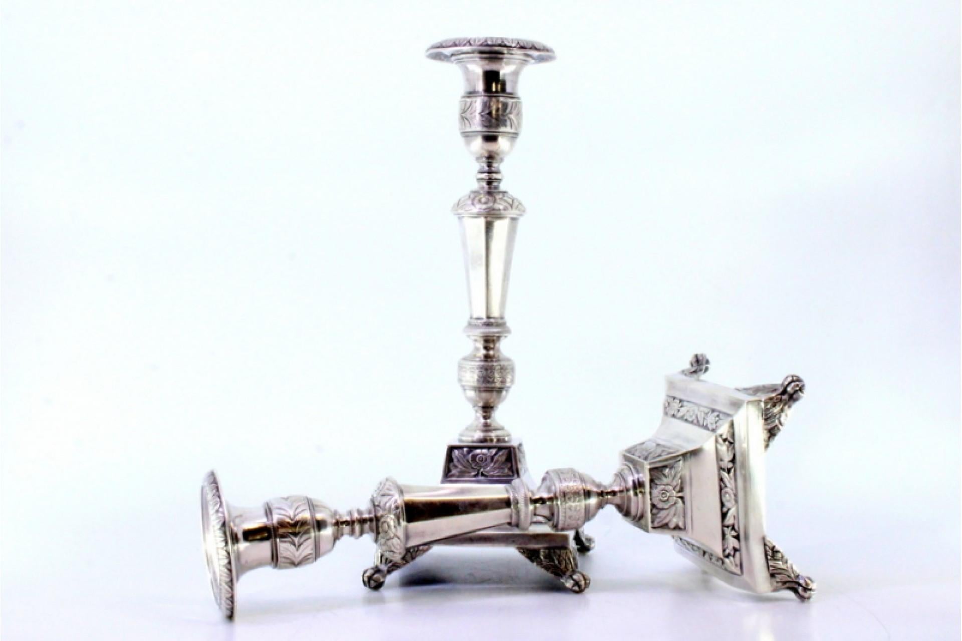 18th Century Silver candlesticks with turned stems, sconces and chiseled bases with claw feet For Sale