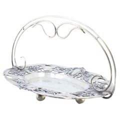 Silver candy box w/ cut-out florals, monogram
4 ball feet