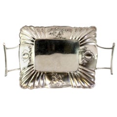 Silver candy box w/ embossed florals, fluted interior 
openwork handles