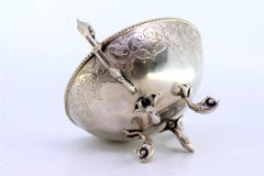 Silver candy box w/ engravings, cut-out handles & resting on 4 fish-shaped feet
