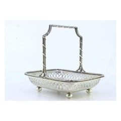 Silver candy box with a fixed beaded handle and ribbon wrapped around it