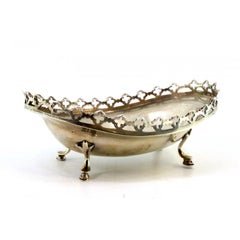 Silver candy box with a rack resting on four horse-legged feet