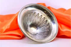 Silver candy box with acanthus-leaf embossing on three tall feet