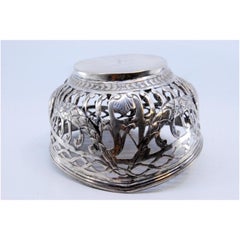 Silver candy box with garland decoration and frills on the rim and base