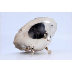 Silver candy box with raised friezes on the rim and resting on three claw feet