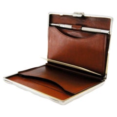 Silver card case with compartments and mechanical pencil