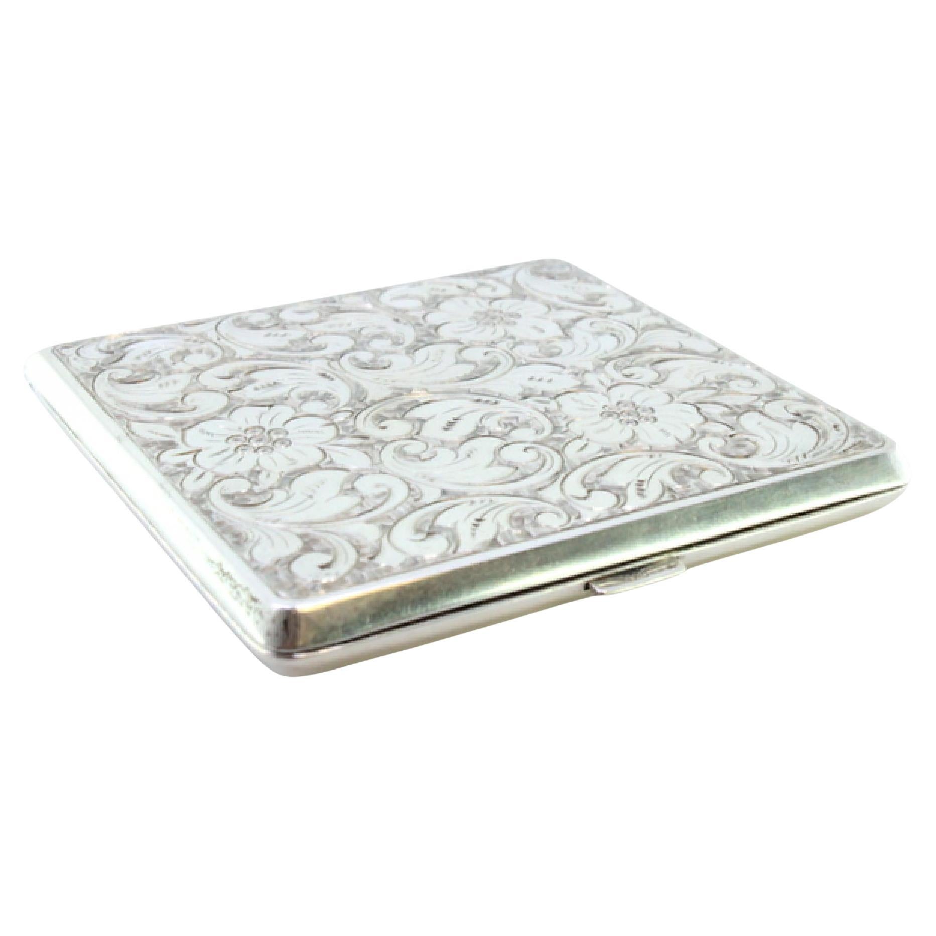 Silver card case with floral engravings, high friezes and spring lid