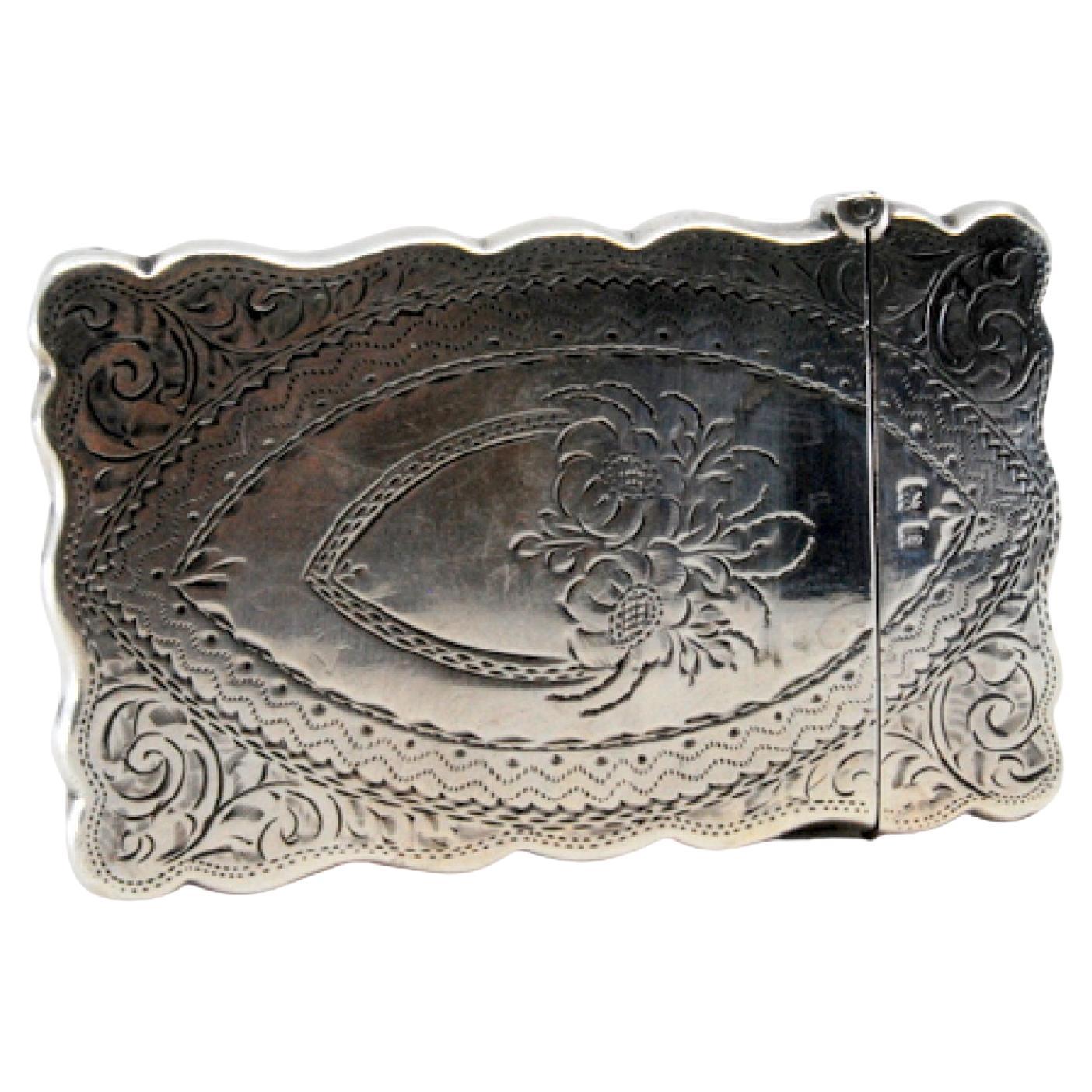 Silver cardboard box with engravings and waves on the edge, hinged lid