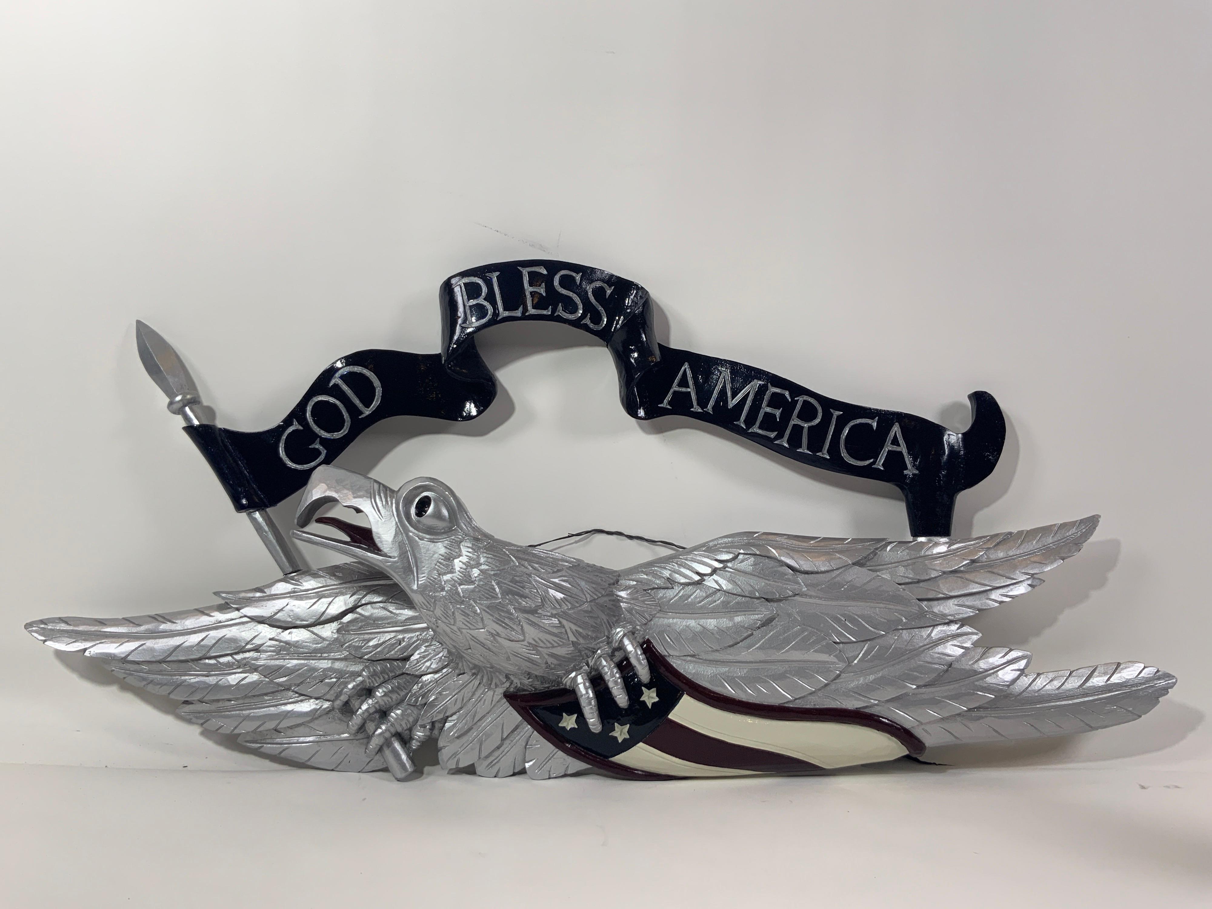 Carved American wooden eagle. Painted silver. 