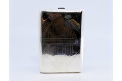 Silver case with diamond engravings on both sides and gold interior