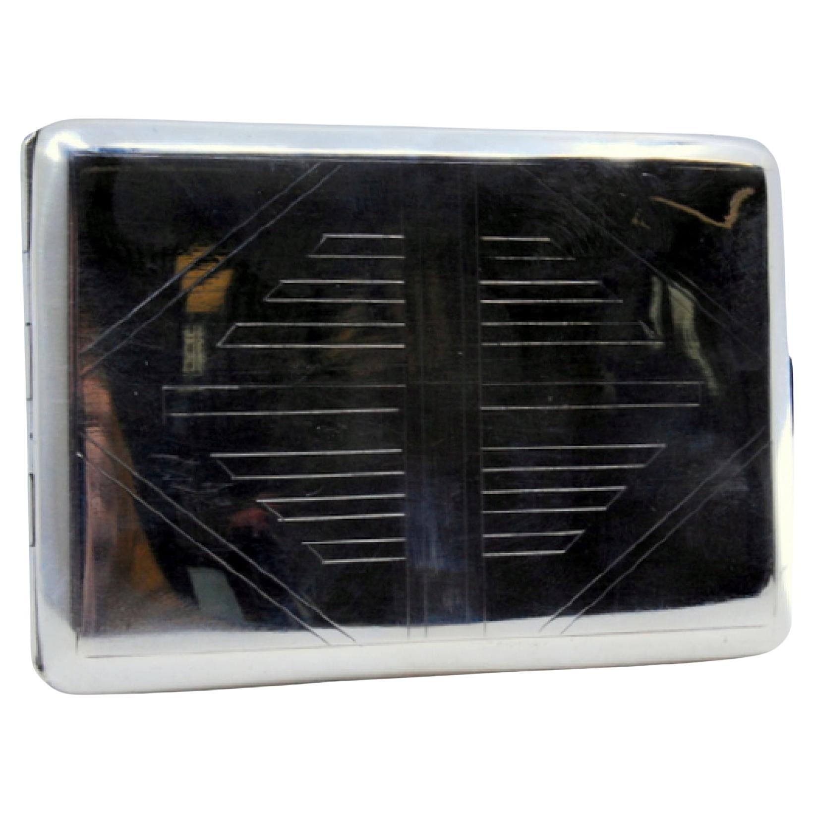 Silver case with diamond engravings on both sides and gold interior