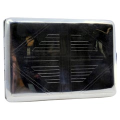 Silver case with diamond engravings on both sides and gold interior