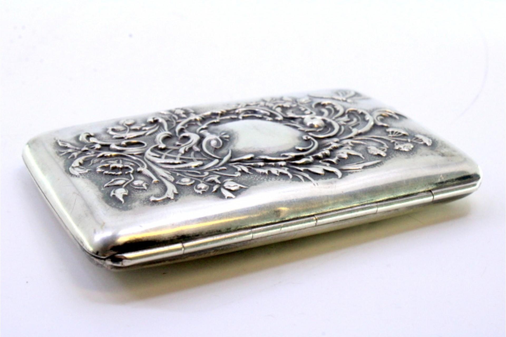 European Silver case with embossed florals around monogram and hinged lid For Sale