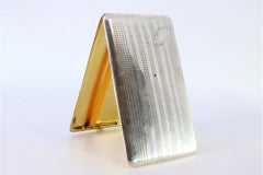 Cassa in argento con fasce longitudinali incise, monogramma e interno in oro