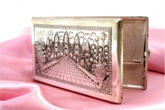 Silver case with floral and Taj Mahal reliefs, map on reverse