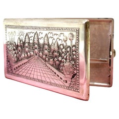 Silver case with floral and Taj Mahal reliefs, map on reverse Silver case with floral and Taj Mahal reliefs, map on reverse