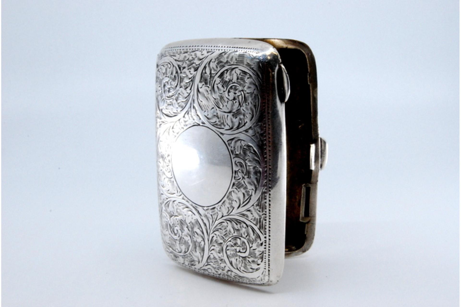 European Silver case with floral engravings around curved monogram and hinged lid For Sale
