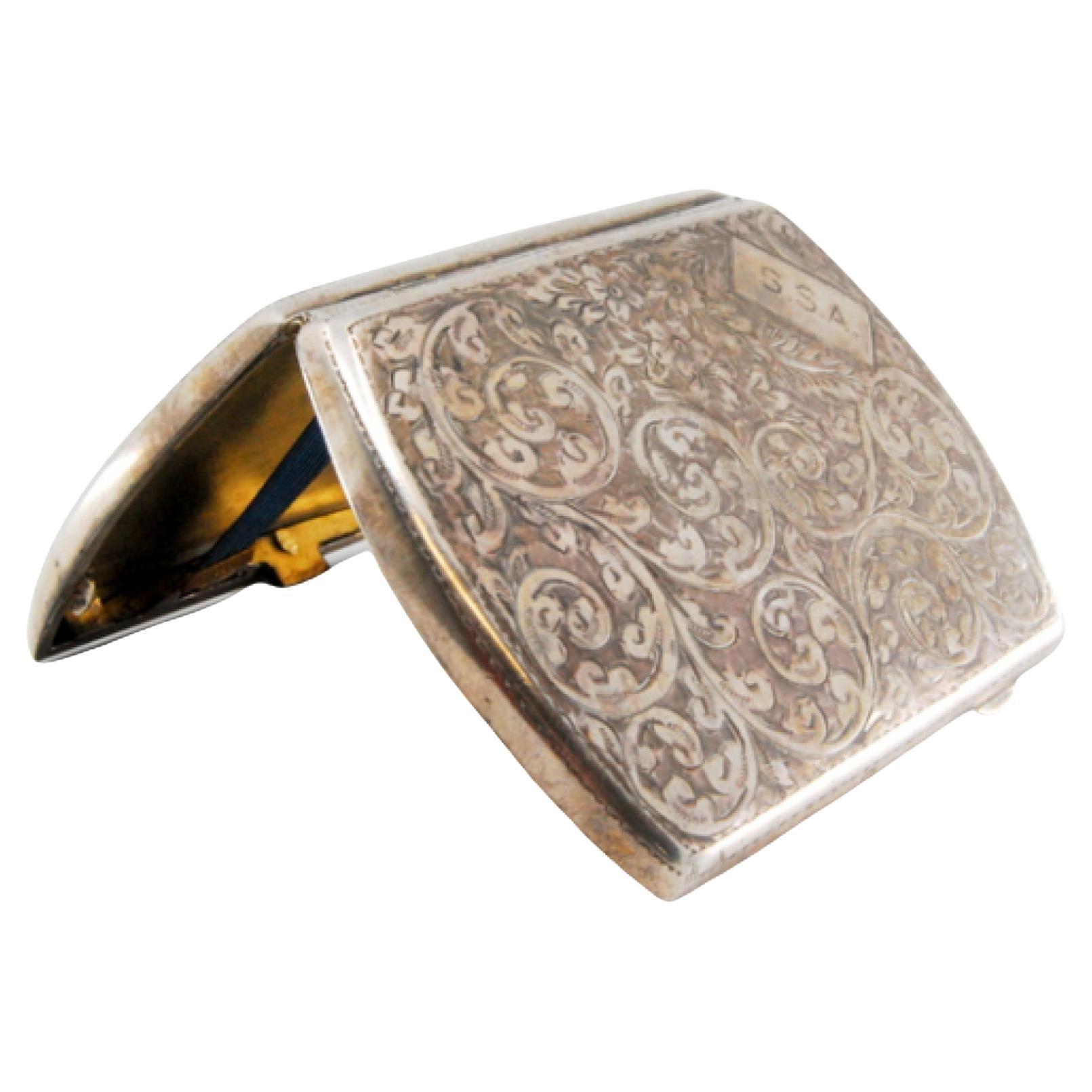 Silver case with floral engravings, monogram and hinged lid