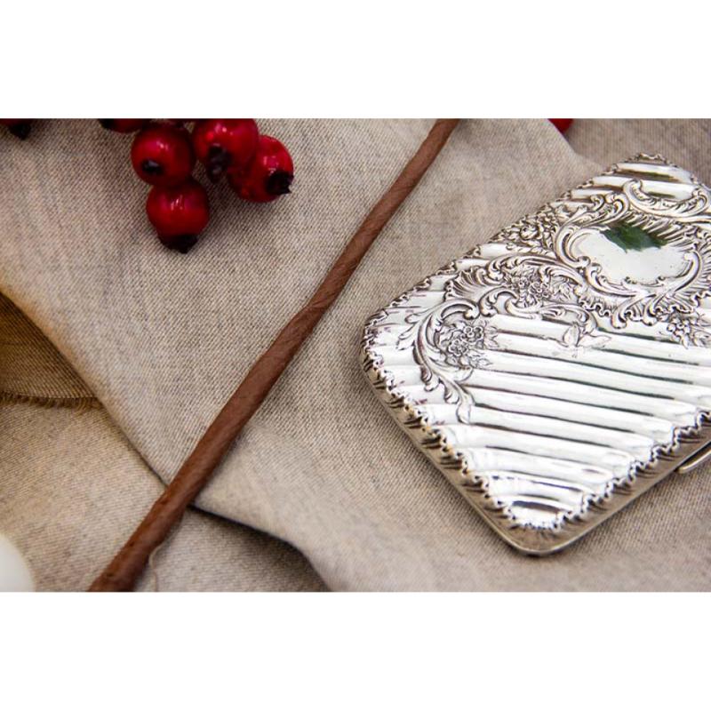 European Silver case with fluted reliefs, floral motifs and garlands around monogram For Sale