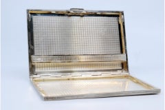 Silver case with herringbone engravings and spring interior support