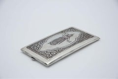 Silver case with Hindu Goddess relief, beaded frame and garlands