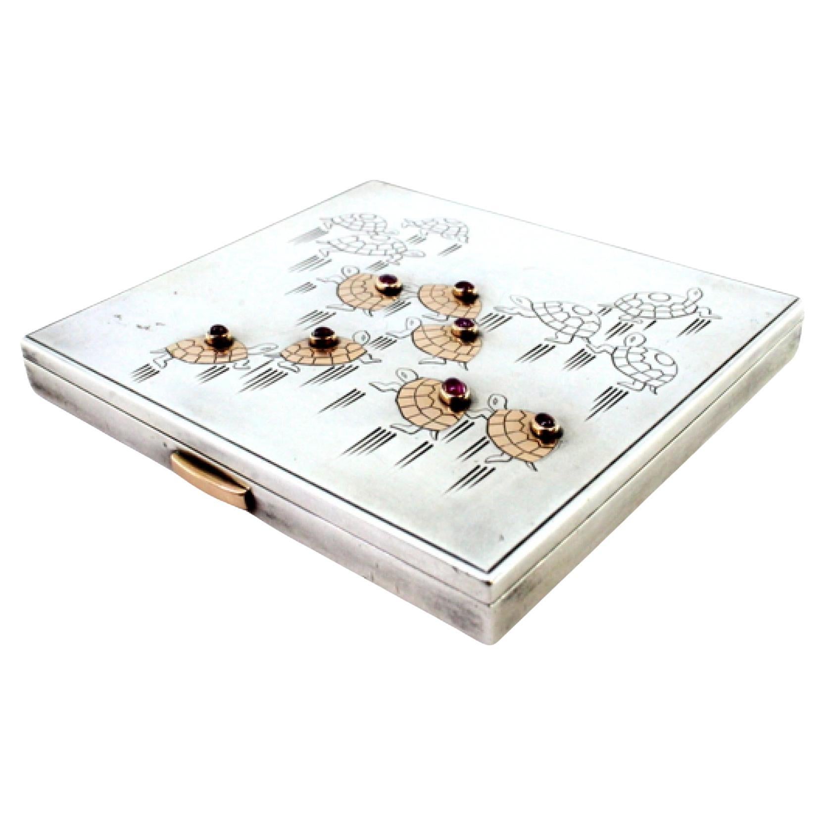 Silver case with top grooves, smooth lid, turtle engravings and cabochons For Sale